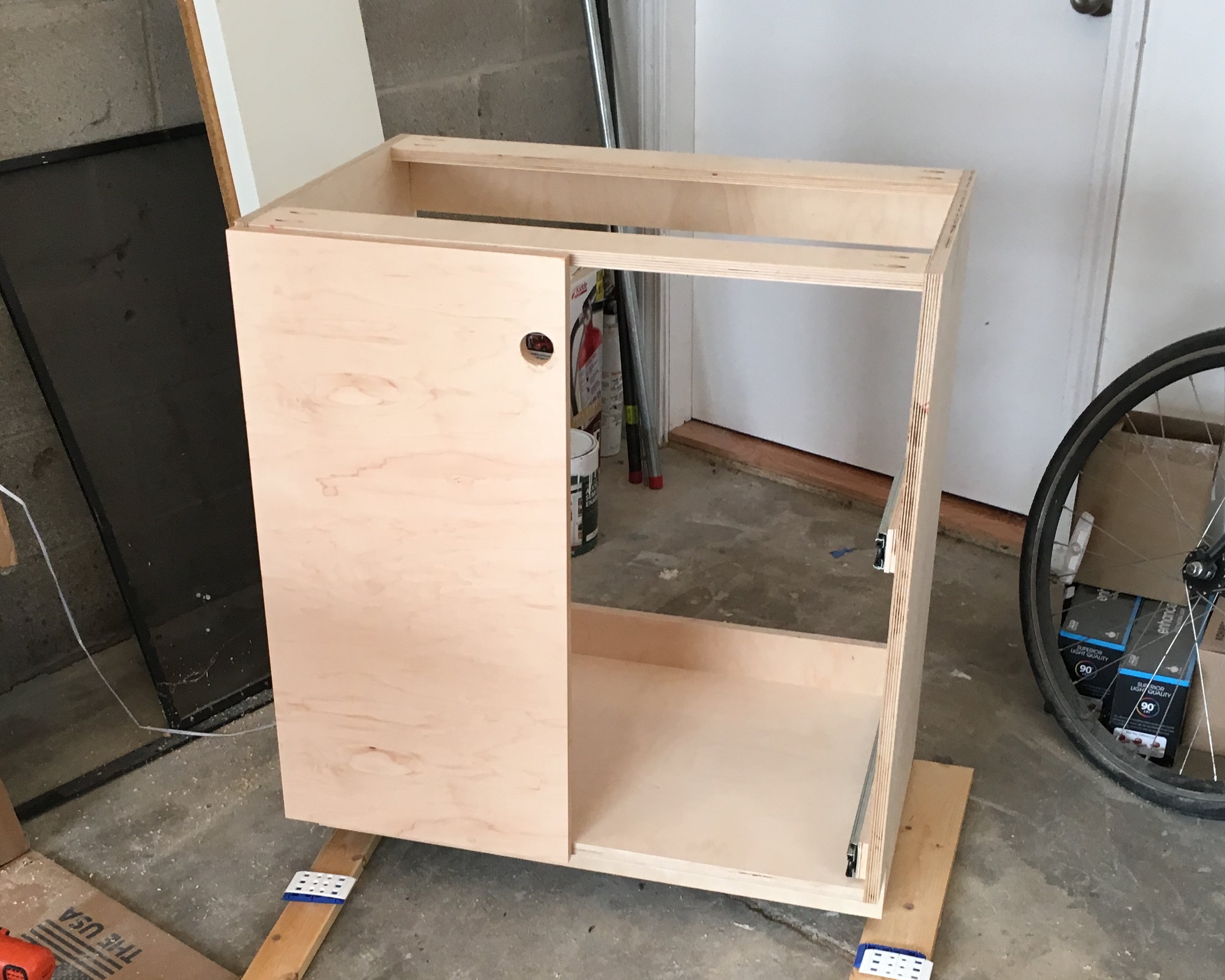 Installation of front doors on the right cabinet.